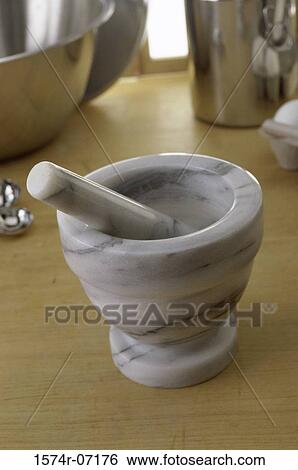 Close-up of a mortar and a pestle View Large Photo Image Stock Photograph - Close-up of a mortar and a pestle. Fotosearch