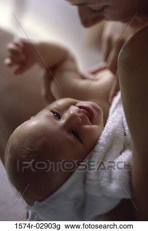 Stock Image - Close-up of a mother playing with her baby boy. Fotosearch
