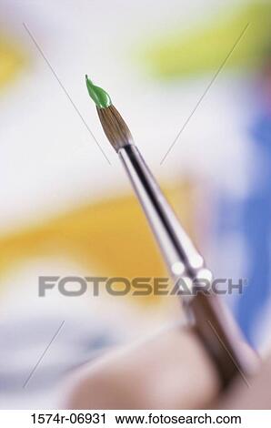 Close-up of a person holding a paintbrush View Large Photo Image Stock Image - Close-up of a person holding a paintbrush. Fotosearch