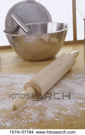 Close-up of a rolling pin near a mixing bowl View Large Photo Image Picture - Close-up of a rolling pin near a mixing bowl. Fotosearch