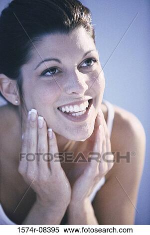 Close-up of a young woman washing her face View Large Photo Image Stock Photography - Close-up of a young woman washing her face. Fotosearch