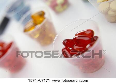 Close-up of an assortment of tablets and capsules in cups View Large Photo Image Stock Image - Close-up of an assortment of tablets and capsules in cups. Fotosearch