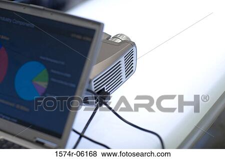 Close-up of projection equipment and a laptop in an office View Large Photo Image Stock Photo - Close-up of projection equipment and a laptop in an office. Fotosearch