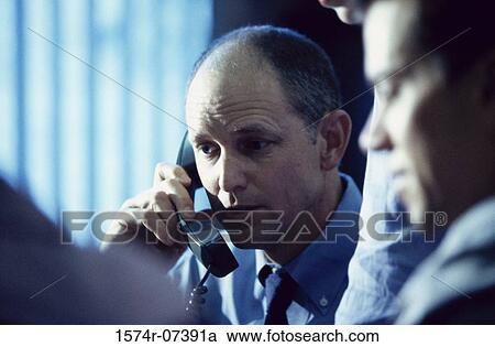 Close-up of two businessmen in an office View Large Photo Image Stock Image - Close-up of two businessmen in an office. Fotosearch