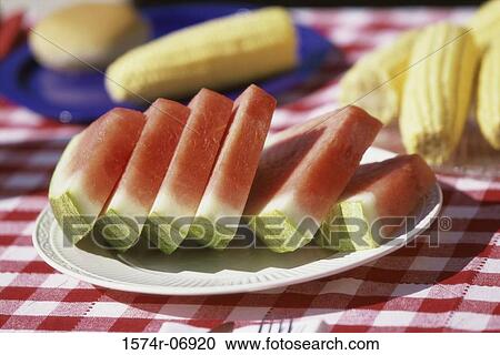 Close-up of watermelon slices on a plate on a picnic table View Large Photo Image Stock Image - Close-up of watermelon slices on a plate on a picnic table. Fotosearch