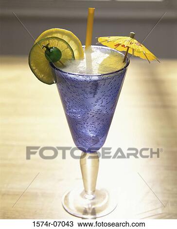 Stock Image - Cocktail with an umbrella and a lemon wedge. Fotosearch