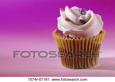 Stock Image - Cupcake with vanilla frosting. Fotosearch