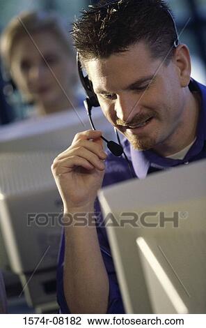 Customer service representative talking on a headset View Large Photo Image Stock Image - Customer service representative talking on a headset. Fotosearch