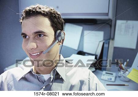Customer service representative wearing a headset View Large Photo Image Stock Image - Customer service representative wearing a headset. Fotosearch