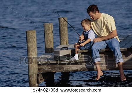 Father and his son sitting on a pier fishing View Large Photo Image Stock Image - Father and his son sitting on a pier fishing. Fotosearch