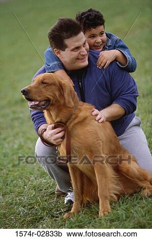 Father and his son with their dog View Large Photo Image Stock Image - Father and his son with their dog. Fotosearch