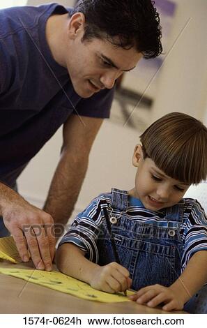 Stock Image - Father drawing with his son. Fotosearch