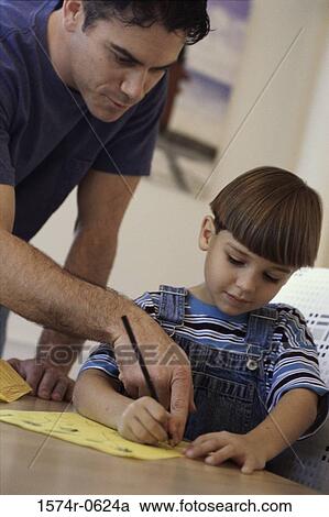 Stock Image - Father teaching his child. Fotosearch
