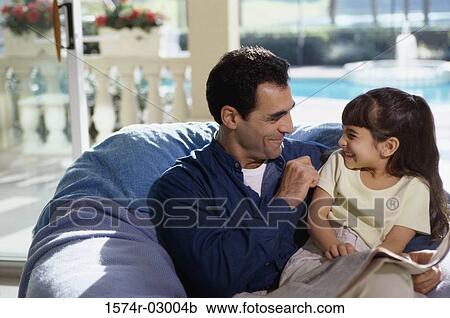 Father tickling his daughter View Large Photo Image Stock Image - Father tickling his daughter. Fotosearch