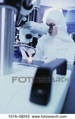 Female researcher looking through the microscope View Large Photo Image Stock Image - Female researcher looking through the microscope. Fotosearch