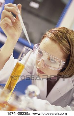 Female researcher working with chemicals View Large Photo Image Stock Image - Female researcher working with chemicals. Fotosearch