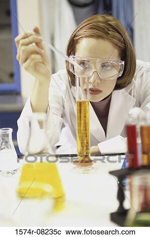 Female researcher working with chemicals View Large Photo Image Stock Image - Female researcher working with chemicals. Fotosearch