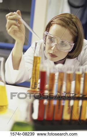 Female researcher working with chemicals View Large Photo Image Stock Photo - Female researcher working with chemicals. Fotosearch