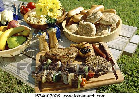 Food served on a picnic table View Large Photo Image Stock Photograph - Food served on a picnic table. Fotosearch