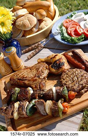 Food served on a picnic table View Large Photo Image Stock Photography - Food served on a picnic table. Fotosearch