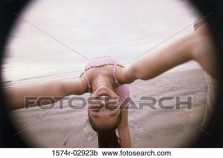 Girl bending over backwards on the beach View Large Photo Image Stock Image - Girl bending over backwards on the beach. Fotosearch