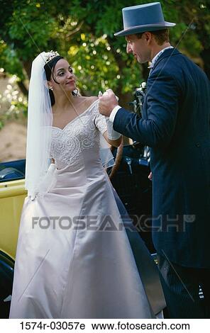 Groom holding his bride's hand View Large Photo Image Stock Image - Groom holding his bride's hand. Fotosearch