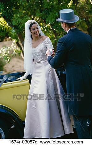 Groom holding his bride's hand View Large Photo Image Stock Image - Groom holding his bride's hand. Fotosearch