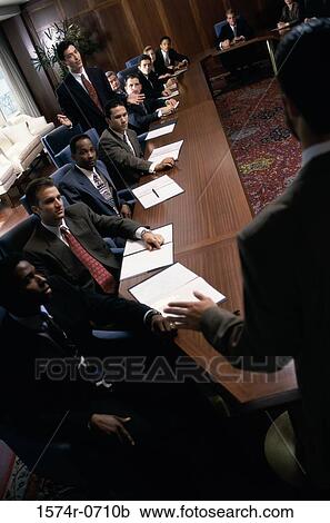 Stock Image - Group of business executives in a meeting. Fotosearch