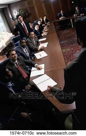 Stock Image - Group of business executives in a meeting. Fotosearch