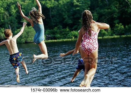 Group of children jumping into water View Large Photo Image Stock Image - Group of children jumping into water. Fotosearch