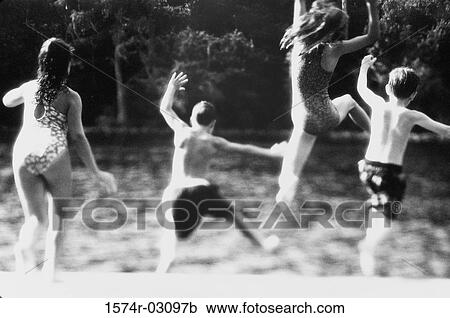 Group of children jumping into water View Large Photo Image Stock Image - Group of children jumping into water. Fotosearch