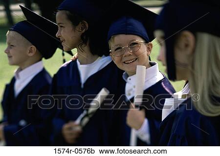 Stock Image - Group of children wearing graduation outfits. Fotosearch