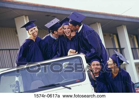 Stock Image - Group of graduates in a jeep. Fotosearch
