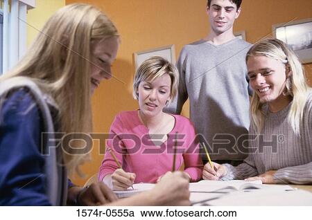 Group of teenagers studying together View Large Photo Image Stock Image - Group of teenagers studying together. Fotosearch