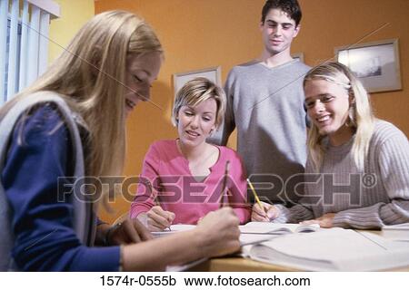 Group of teenagers studying together View Large Photo Image Stock Image - Group of teenagers studying together. Fotosearch