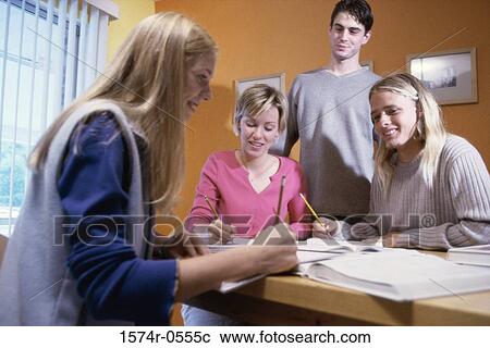 Group of teenagers studying together View Large Photo Image Stock Image - Group of teenagers studying together. Fotosearch