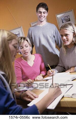 Group of teenagers studying together View Large Photo Image Stock Image - Group of teenagers studying together. Fotosearch