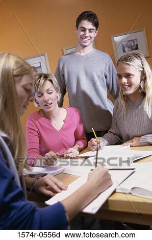 Group of teenagers studying together View Large Photo Image Stock Image - Group of teenagers studying together. Fotosearch
