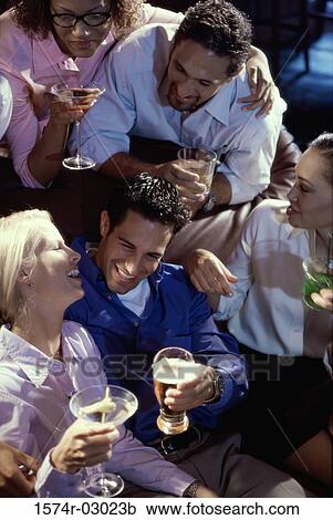 Group of young people in a bar View Large Photo Image Stock Image - Group of young people in a bar. Fotosearch