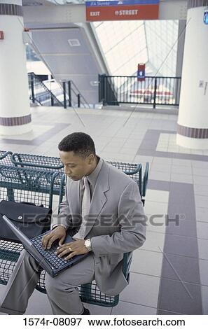 High angle view of a businessman working on a laptop View Large Photo Image Stock Photo - High angle view of a businessman working on a laptop. Fotosearch