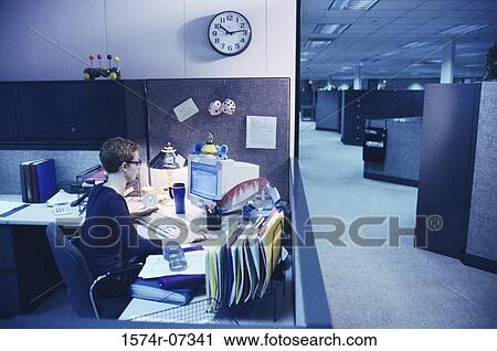 Stock Image - High angle view of a businesswoman working on a computer. Fotosearch