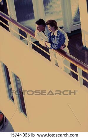 Stock Image - High angle view of a mid adult couple on a cruise ship. Fotosearch
