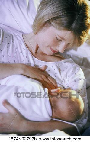 High angle view of a mother breastfeeding her baby boy View Large Photo Image Stock Image - High angle view of a mother breastfeeding her baby boy. Fotosearch