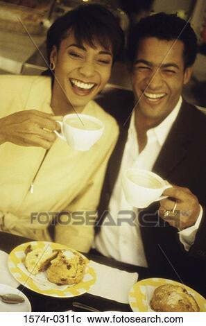 Stock Image - High angle view of a young couple in a restaurant. Fotosearch