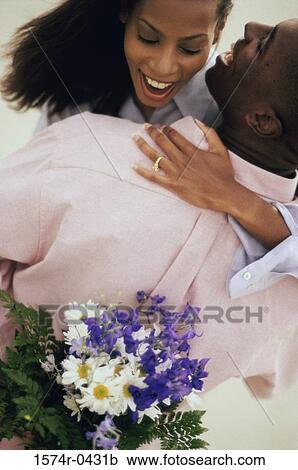 High angle view of a young couple with bouquet of flowers View Large Photo Image Stock Image - High angle view of a young couple with bouquet of flowers. Fotosearch