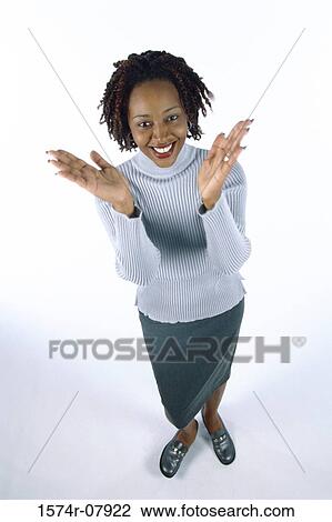 Stock Image - High angle view of a young woman clapping her hands. Fotosearch