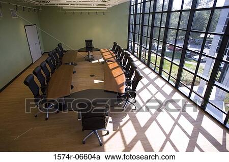 Stock Image - High angle view of chairs and a table in a boardroom. Fotosearch