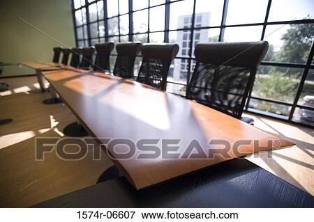 Stock Photo - High angle view of chairs and a table in a boardroom. Fotosearch