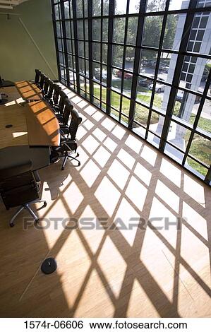 Stock Photograph - High angle view of chairs and a table in a boardroom. Fotosearch