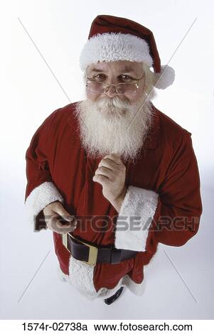 Stock Image - High angle view of Santa Claus looking at the camera. Fotosearch